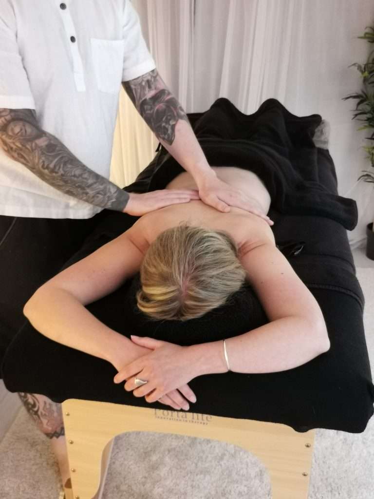 massage of lady on massage bed